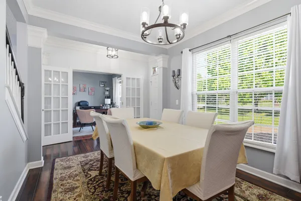 a kitchen with stainless steel appliances granite countertop a stove top oven a refrigerator and dishwasher