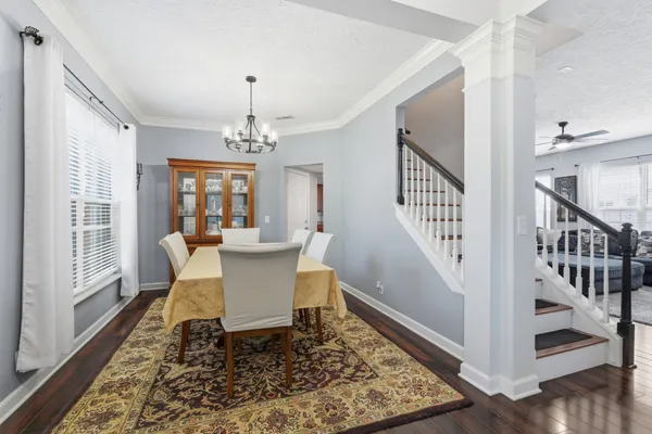 a view of a dining room with furniture and window