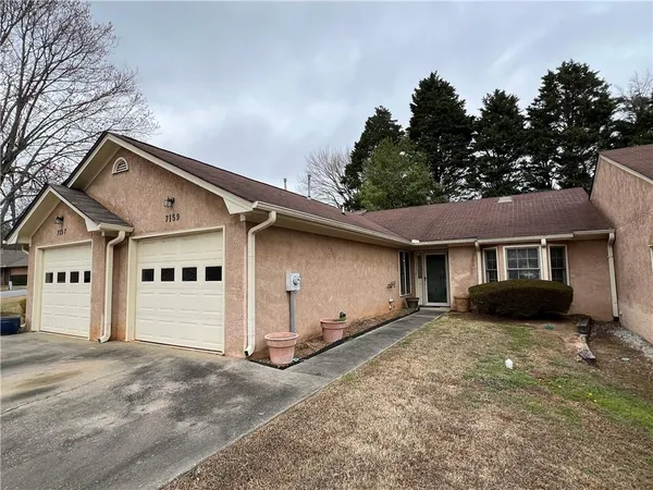 front view of a house with a yard