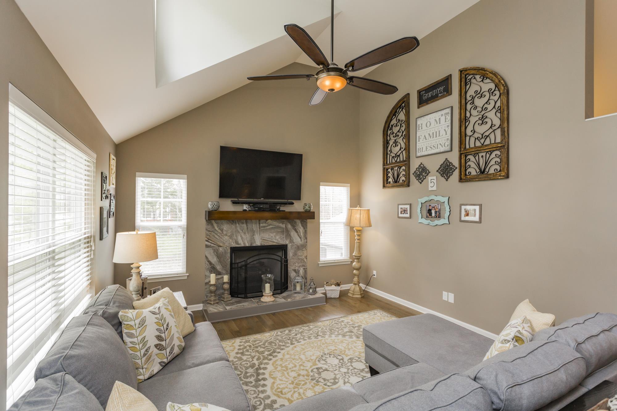 1354 Campbell Ridge Road Kingston Springs, TN 37082 - Photo 3 of 26 a living room with furniture and a fireplace