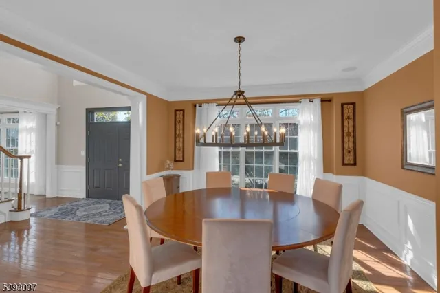 a view of staircase with wooden floor and a rug