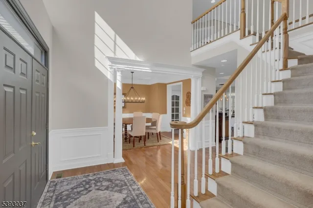 a living room with furniture a window and a potted plant