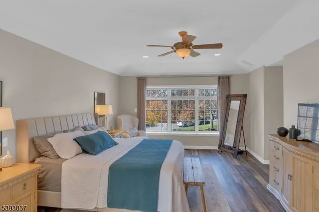 a bedroom with a bed and a chair