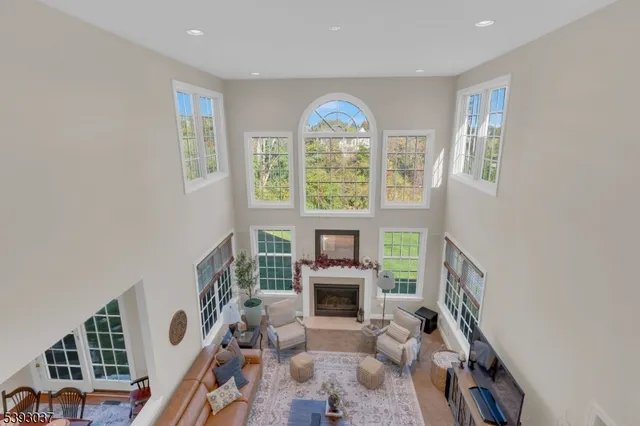 a view of backyard with swimming pool and outdoor seating