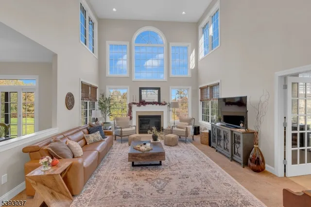 a living room with furniture flat screen tv and a fireplace