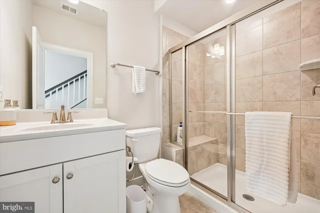 a bathroom with a toilet sink and a shower