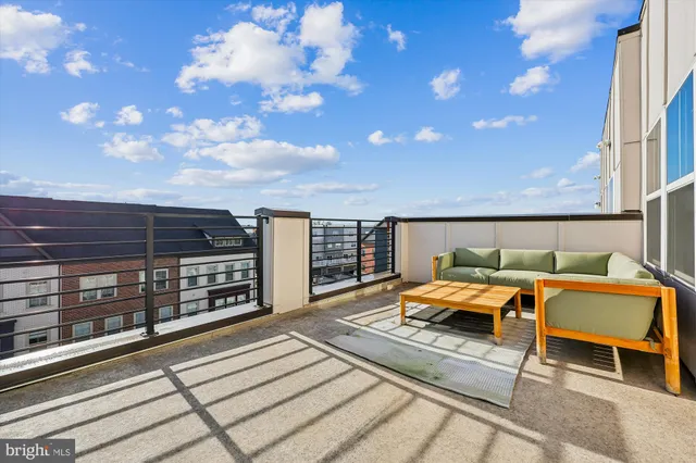 a terrace view with sitting space and outdoor seating