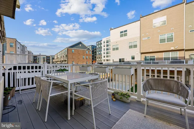 a view of a chairs and a table in the balcony