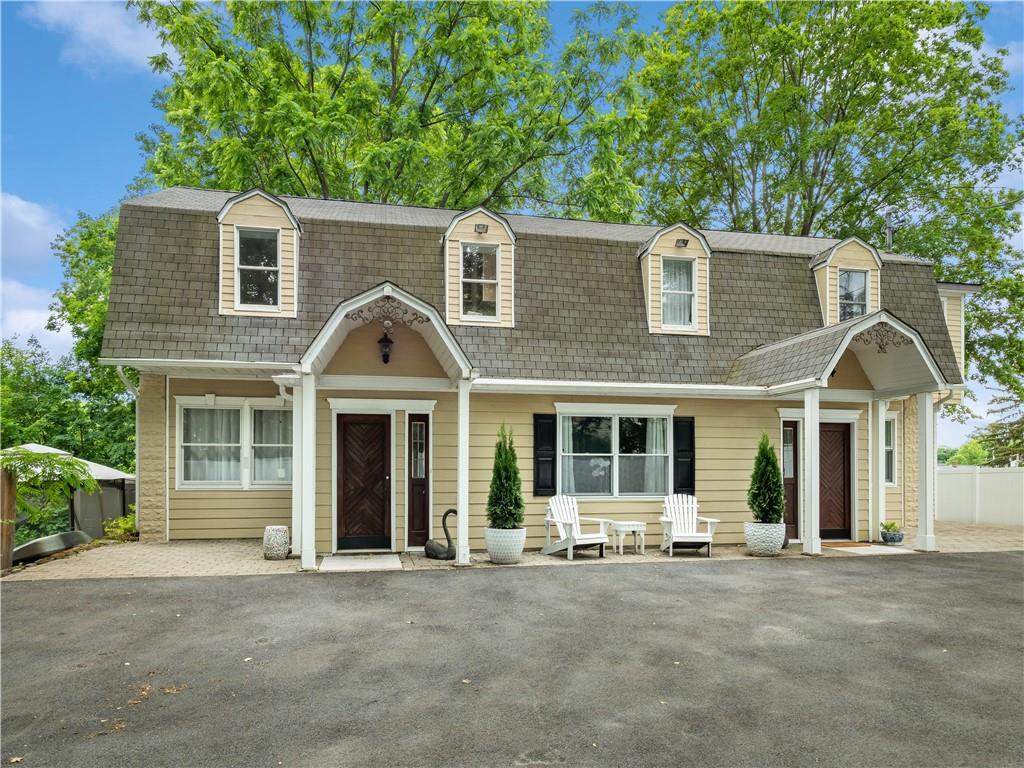 1 Division Street Cold Spring, NY 10516 - Photo 1 of 1 front view of a house with a garden