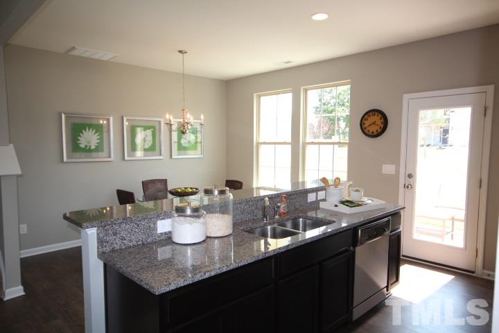 1014 Grand Ridge Drive Rolesville, NC 27571 - Photo 11 of 25 a dining room with mirror and window