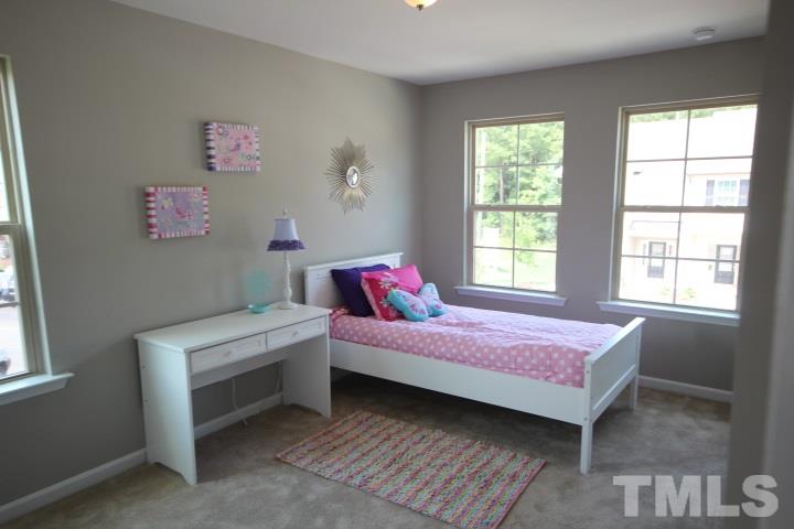1014 Grand Ridge Drive Rolesville, NC 27571 - Photo 15 of 25 a bedroom with a bed and a window