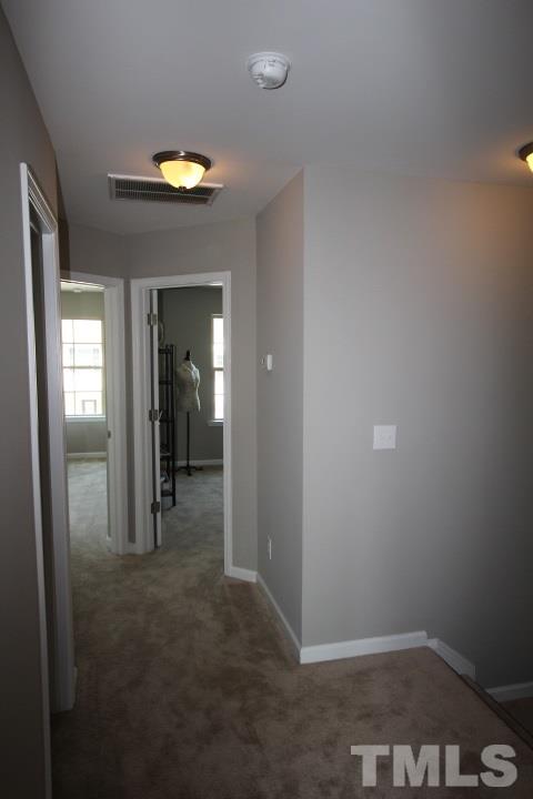 1014 Grand Ridge Drive Rolesville, NC 27571 - Photo 18 of 25 a view of hallway with bathroom