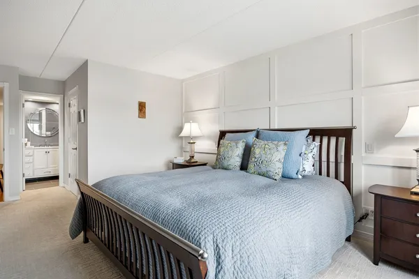 a bedroom with a bed and a walk in closet