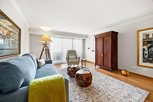 a living room with furniture and a rug