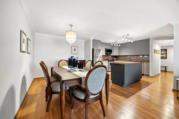a view of a dining room with furniture and wooden floor