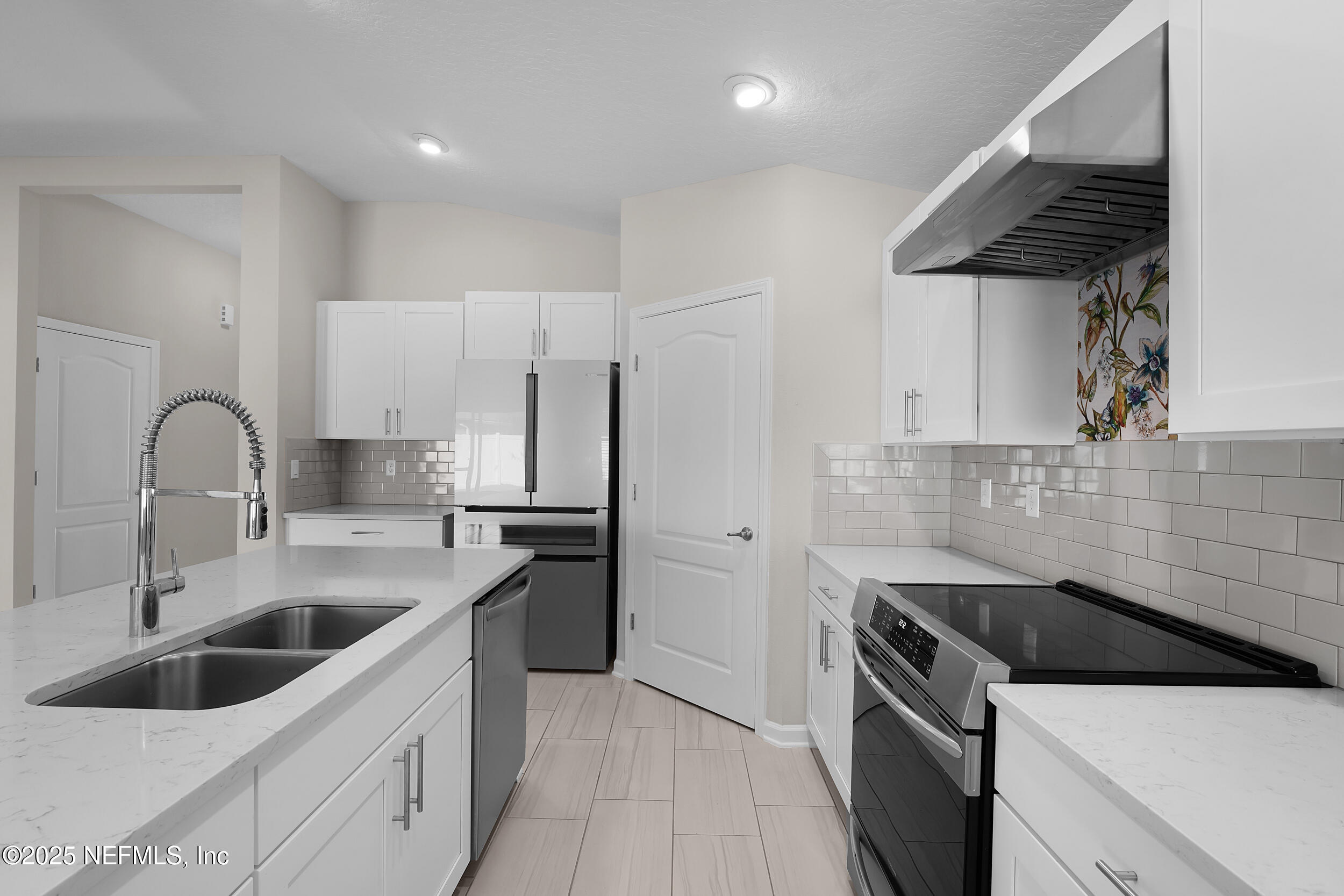 516 Lumpkin Street Jacksonville, FL 32222 - Photo 12 of 45 a kitchen with a sink cabinets and stainless steel appliances