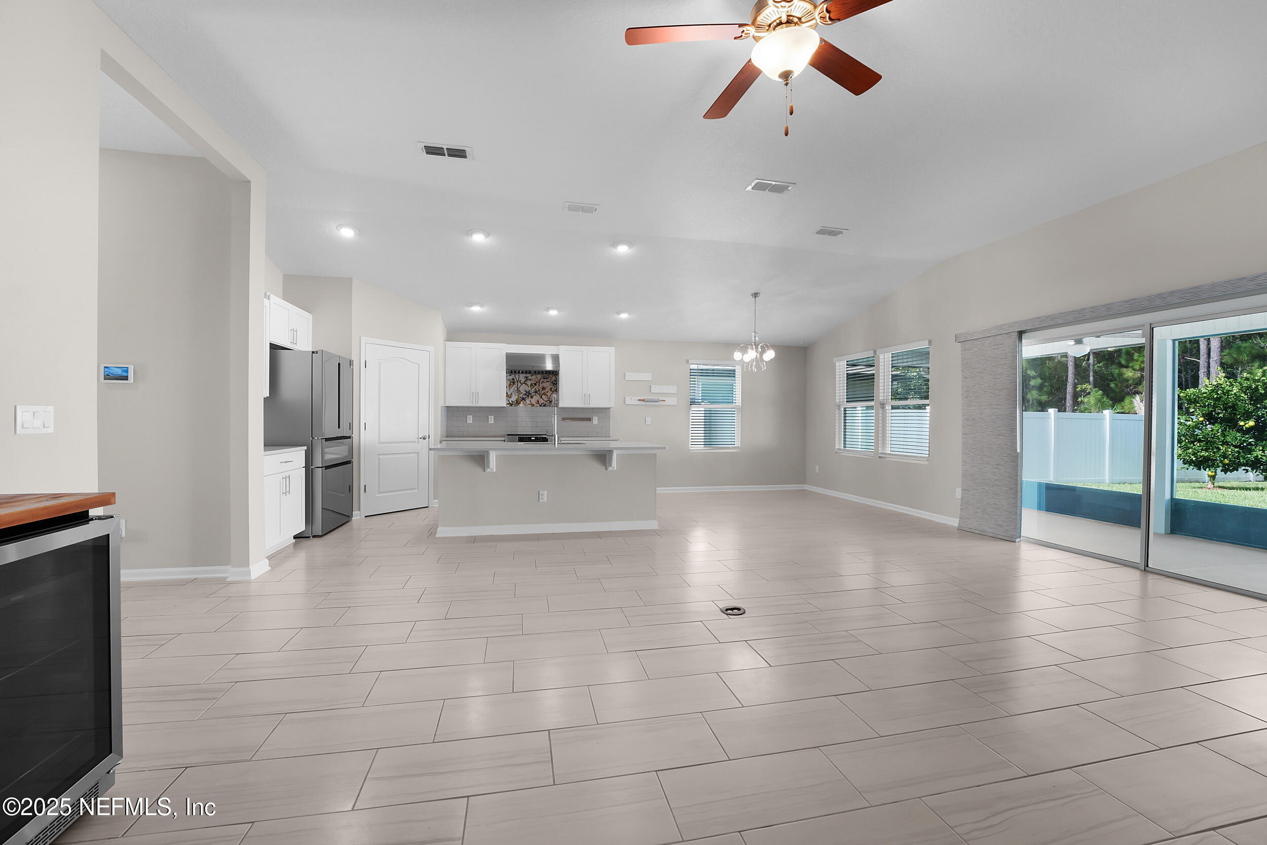 516 Lumpkin Street Jacksonville, FL 32222 - Photo 13 of 45 a view of a living room a kitchen and windows
