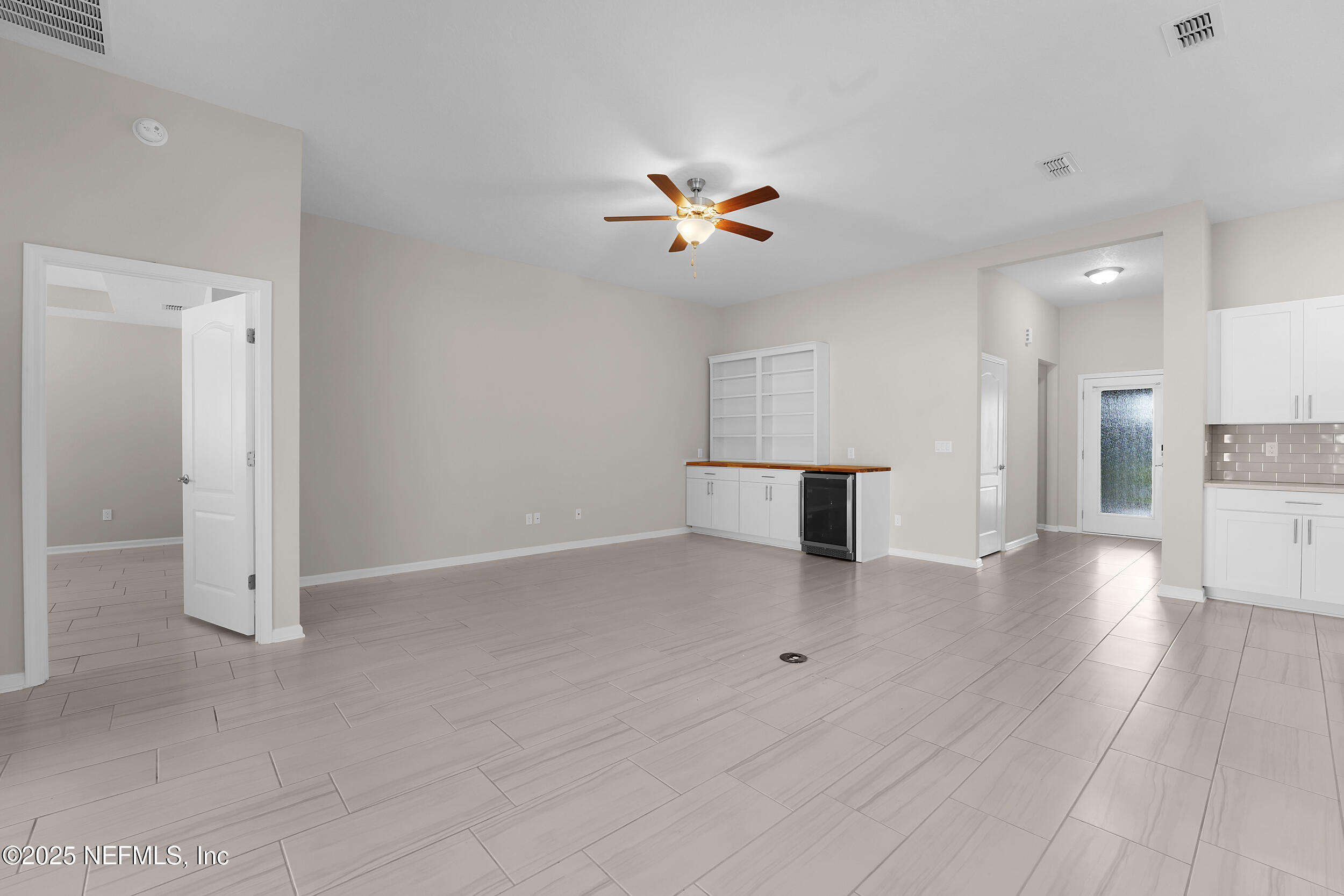 516 Lumpkin Street Jacksonville, FL 32222 - Photo 15 of 45 a view of an empty room with a ceiling fan