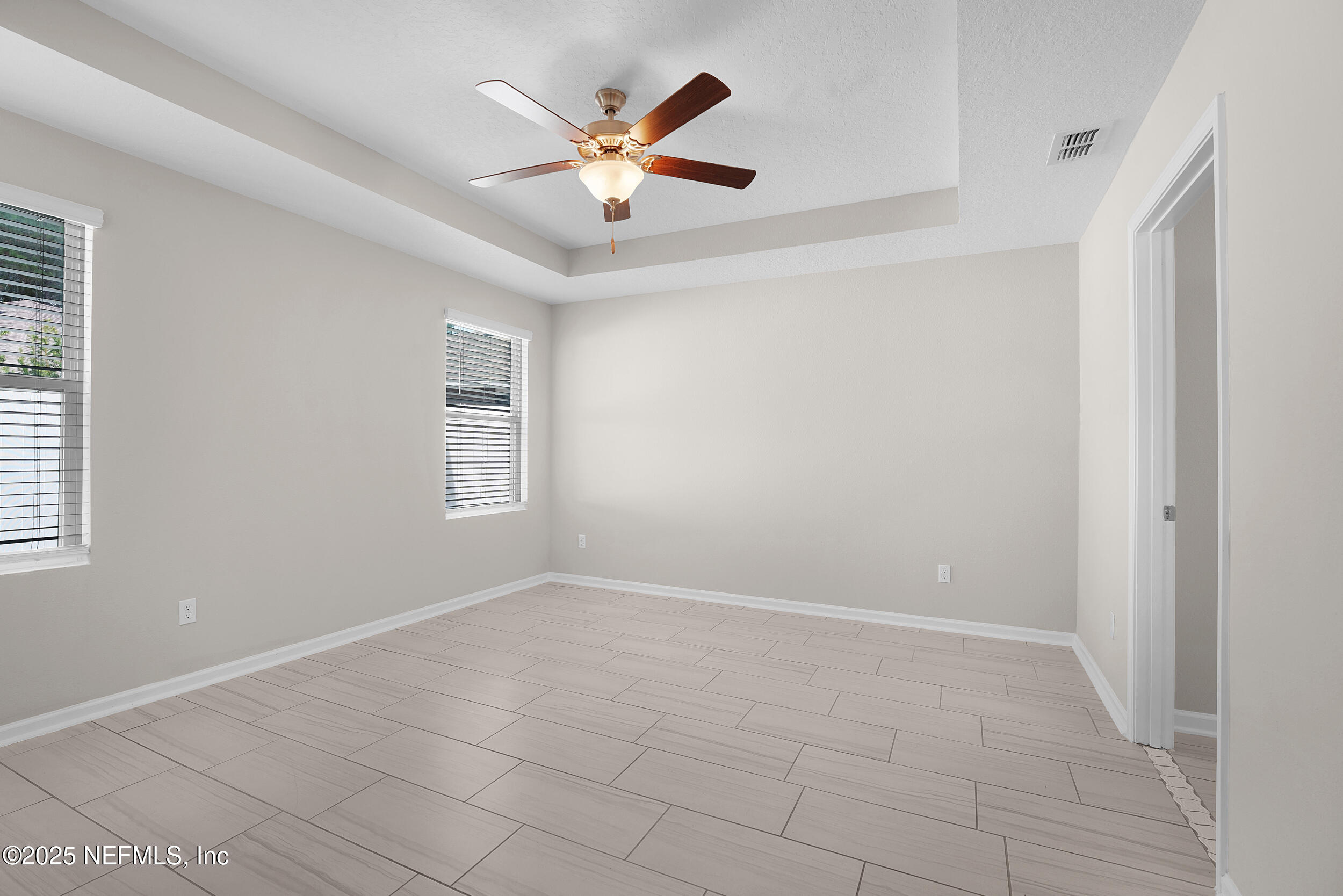 516 Lumpkin Street Jacksonville, FL 32222 - Photo 17 of 45 a view of an empty room with a window