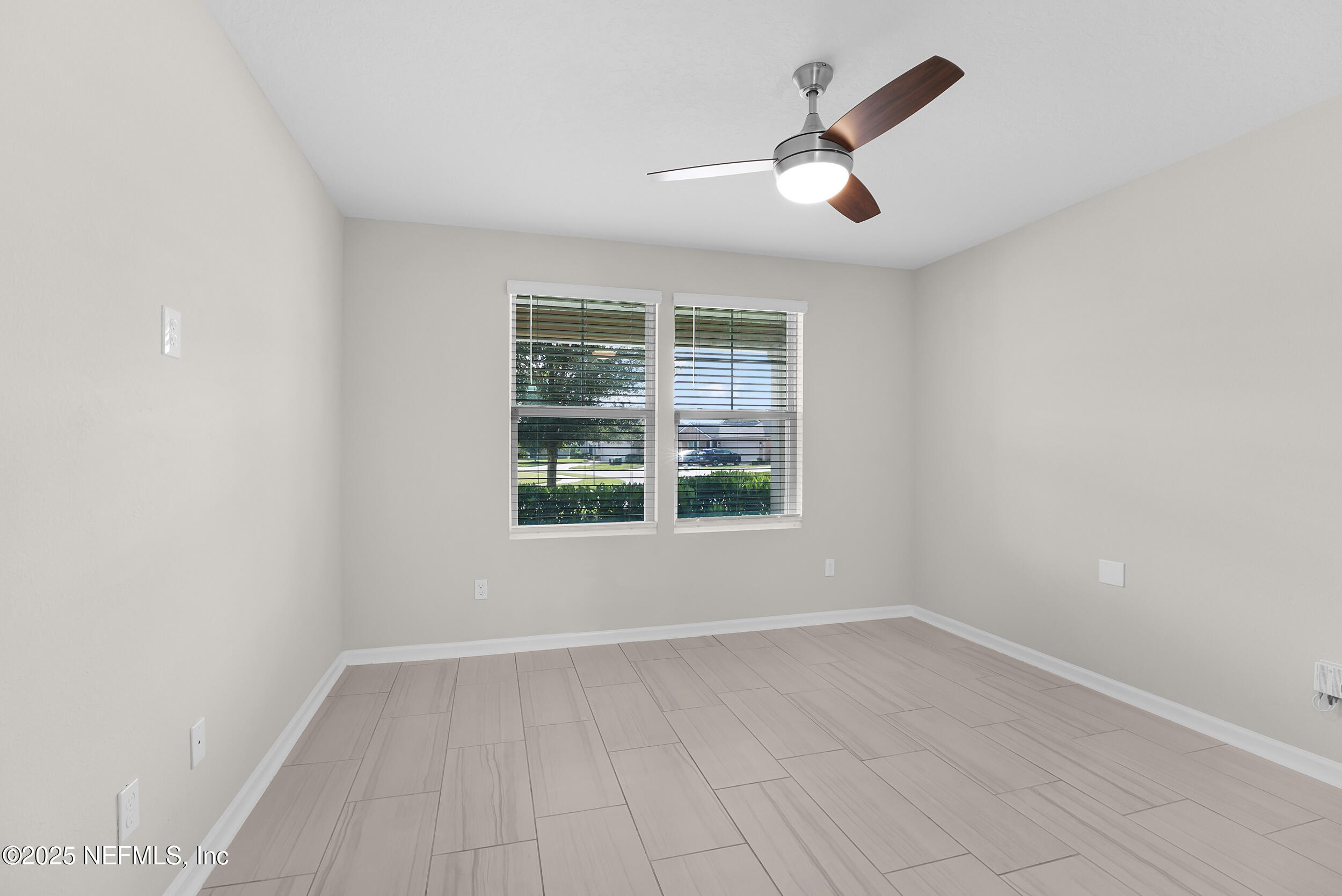 516 Lumpkin Street Jacksonville, FL 32222 - Photo 21 of 45 an empty room with wooden floor and windows