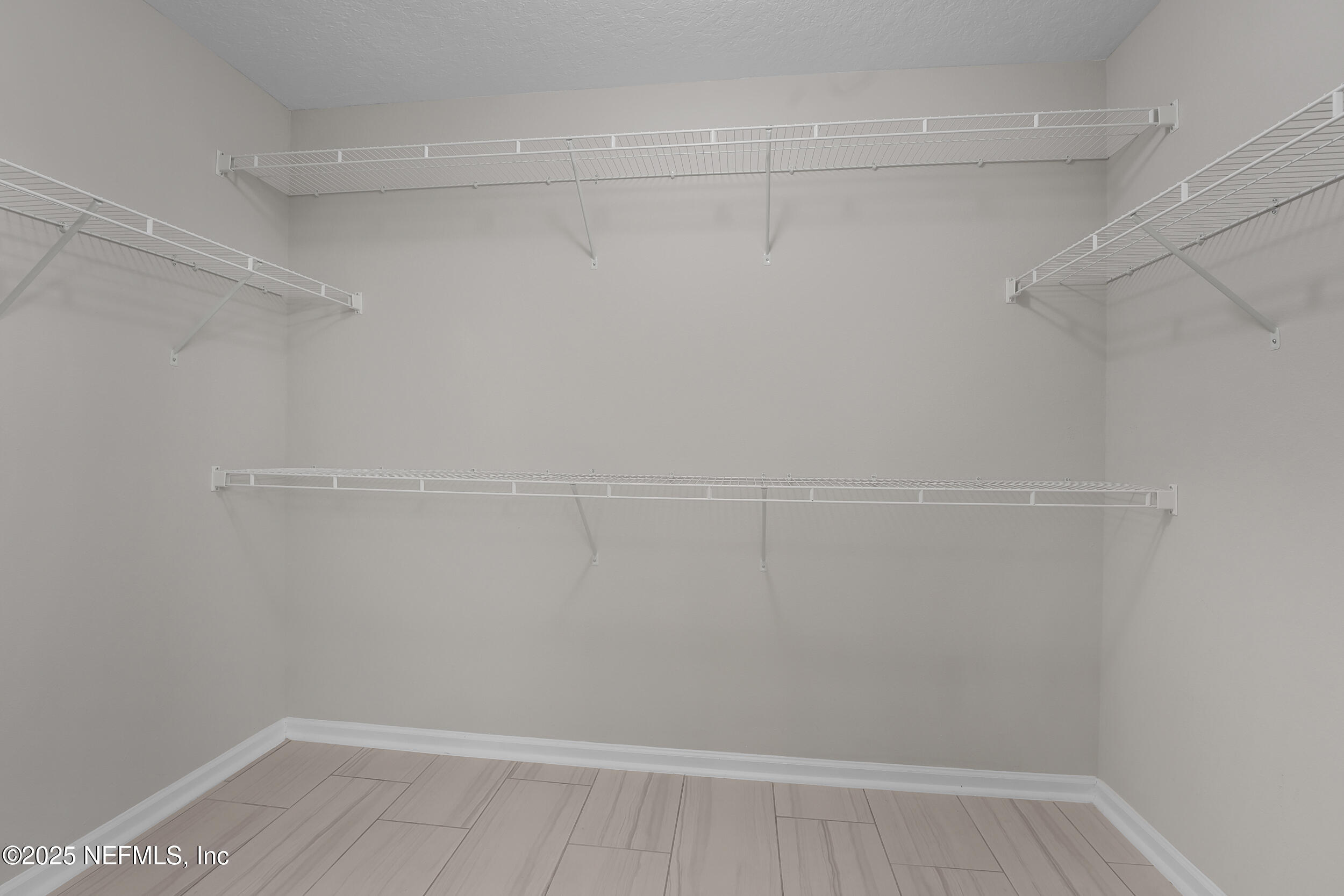 516 Lumpkin Street Jacksonville, FL 32222 - Photo 25 of 45 a view of a room with racks on the wall