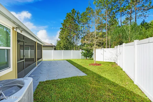 a view of backyard with green space
