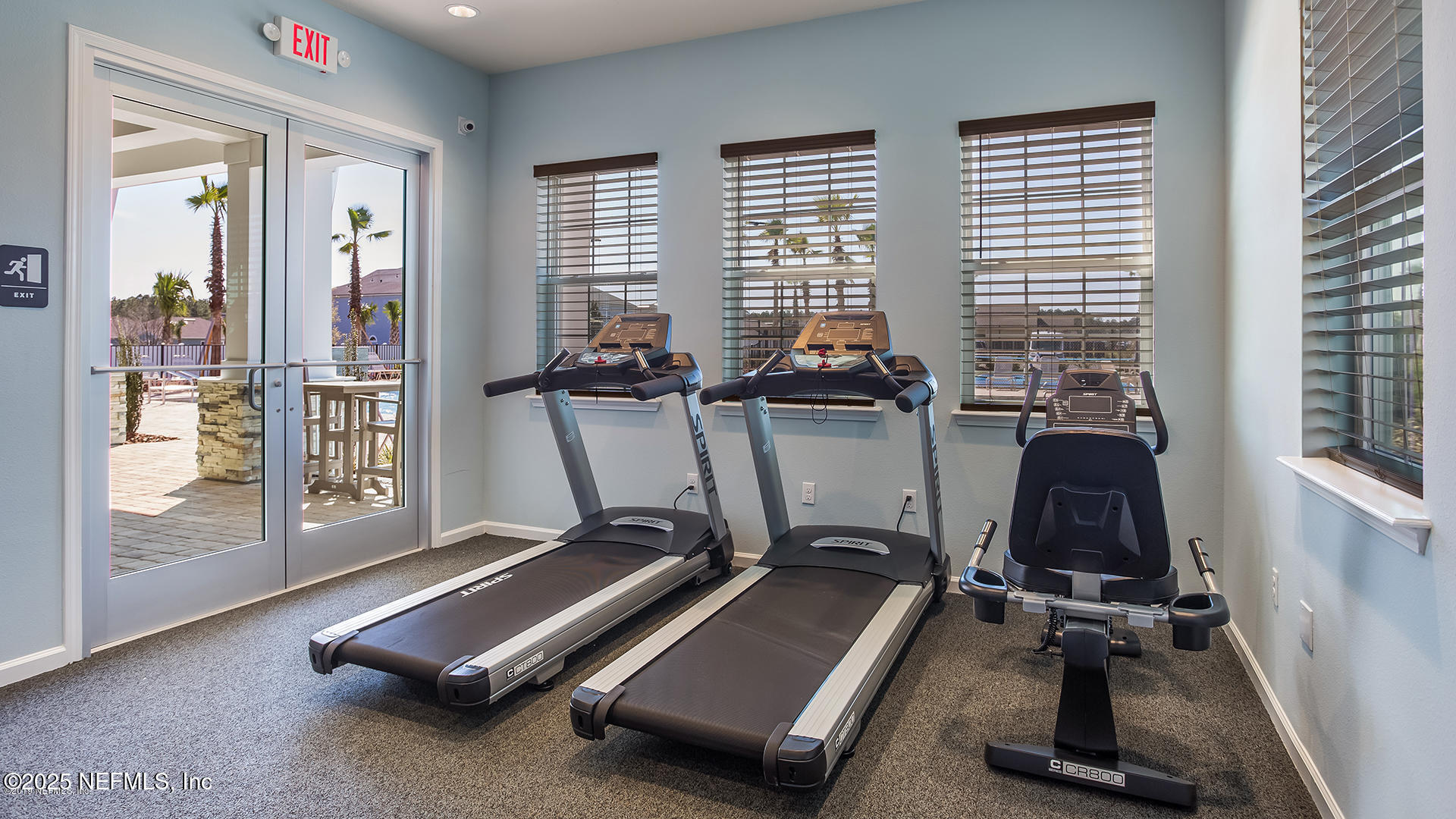 516 Lumpkin Street Jacksonville, FL 32222 - Photo 36 of 45 a room with gym equipment and large windows