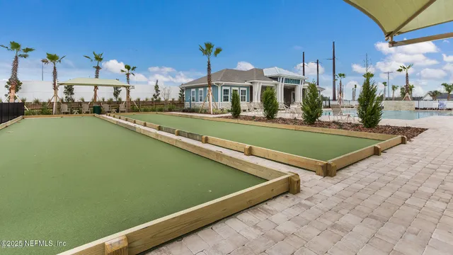 a view of a patio with swimming pool table and chairs