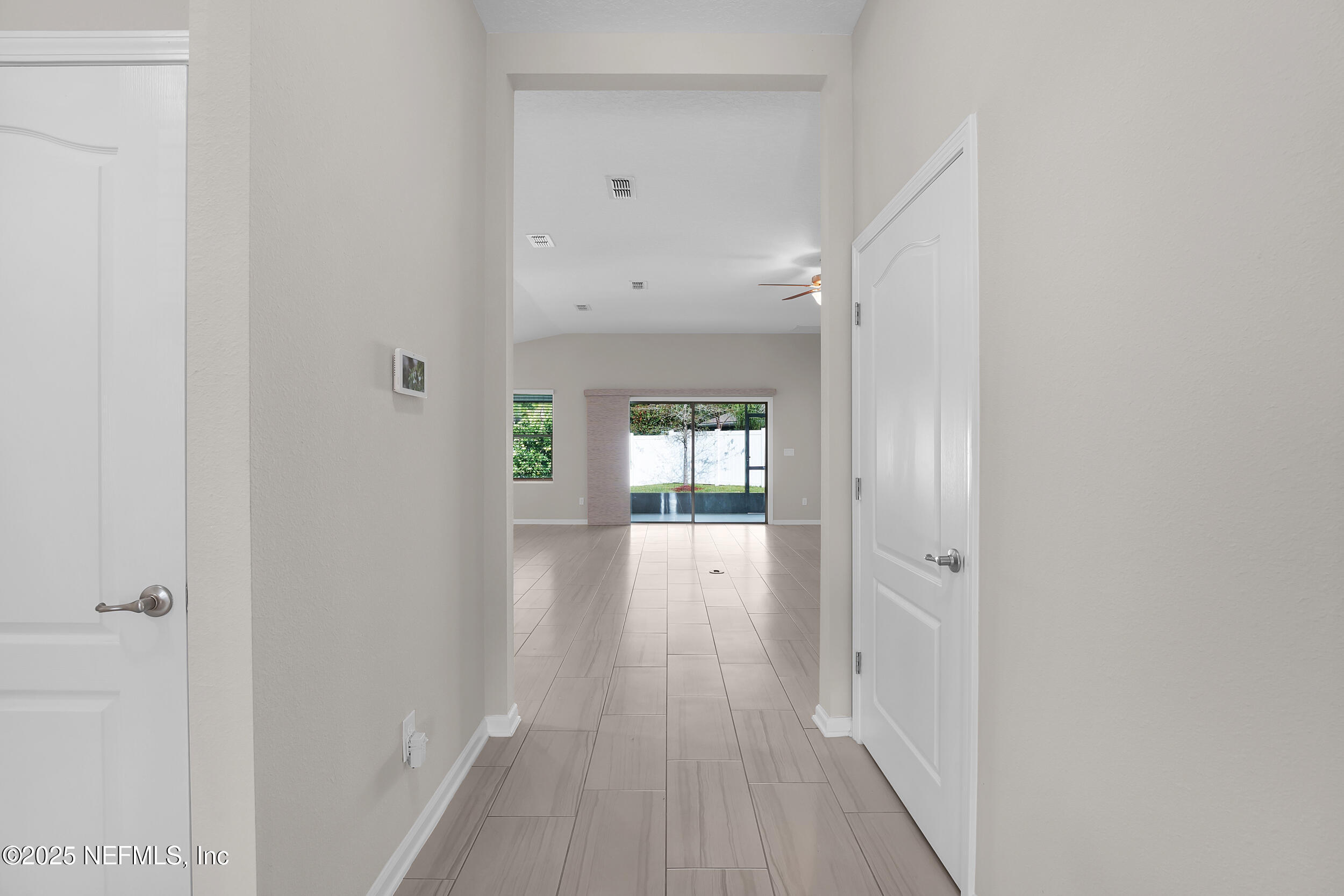 516 Lumpkin Street Jacksonville, FL 32222 - Photo 5 of 45 a view of a hallway with wooden floor