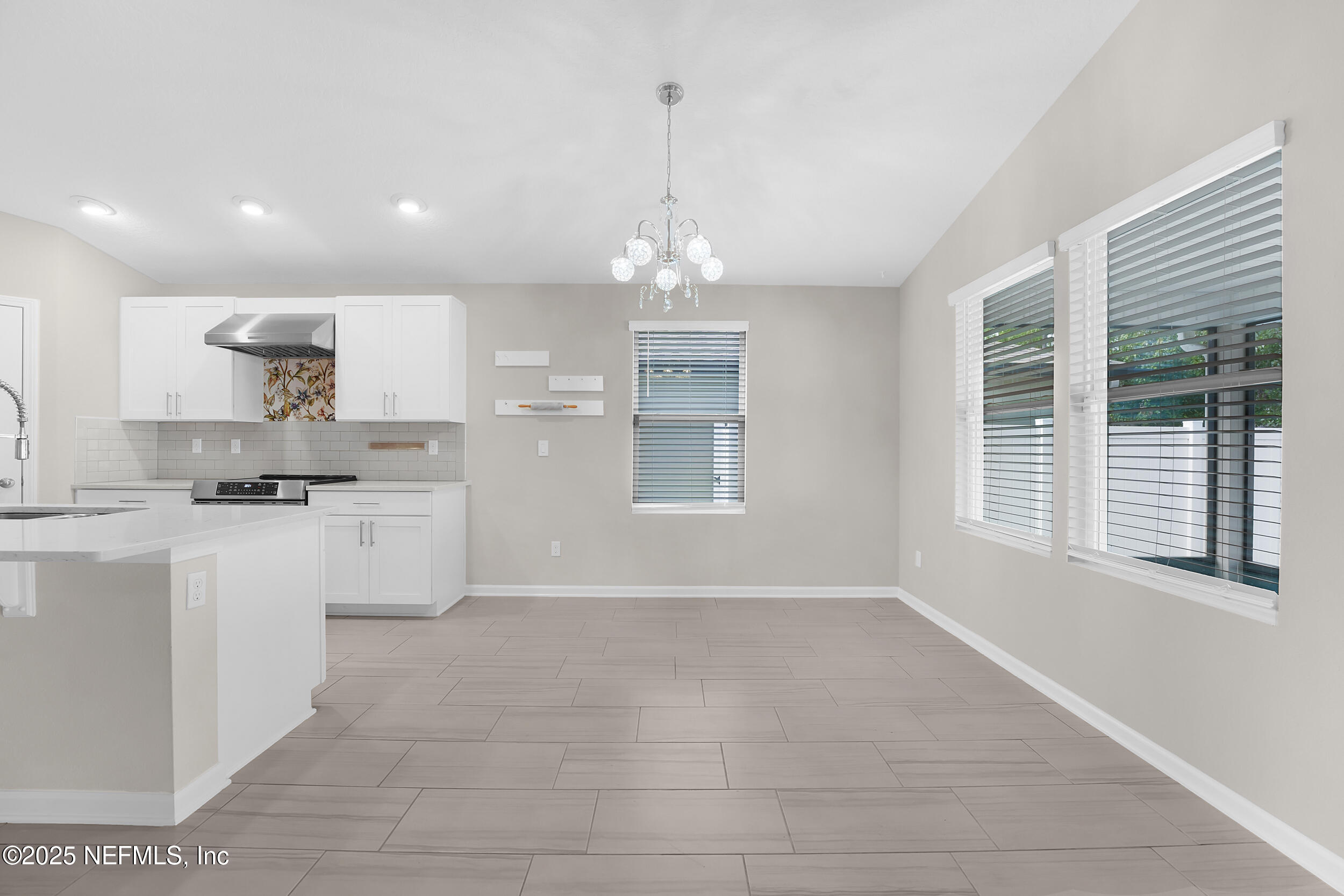 516 Lumpkin Street Jacksonville, FL 32222 - Photo 9 of 45 a open kitchen with white cabinets and a dishwasher