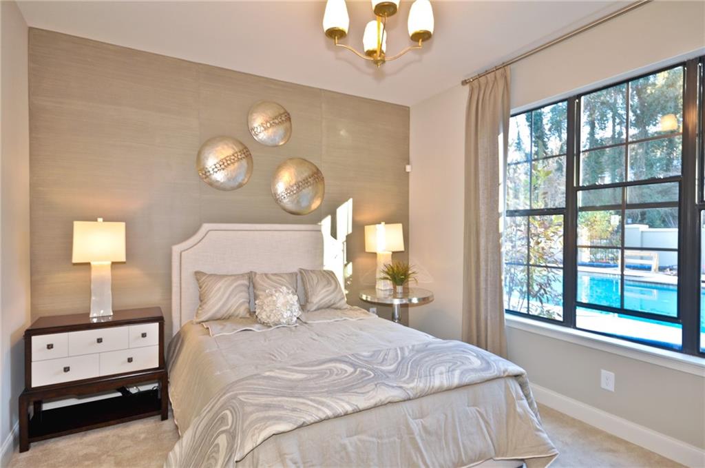 4011 Roswell Road, Unit 2311 Atlanta, GA 30342 - Photo 16 of 39 a bedroom with a bed and a window