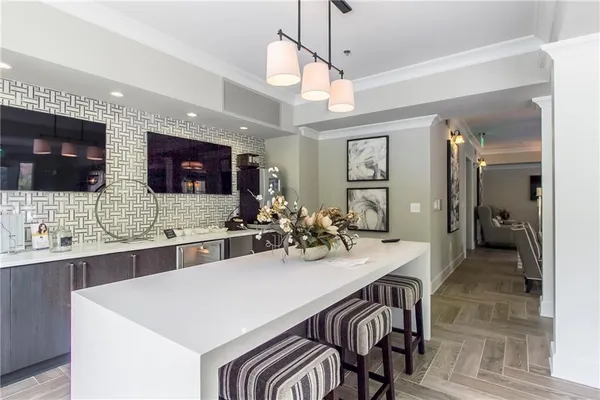 a large kitchen with a table and chairs