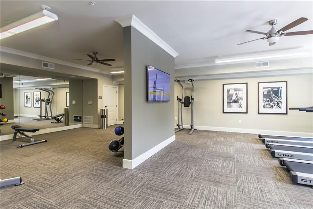4011 Roswell Road, Unit 2311 Atlanta, GA 30342 - Photo 29 of 39 a living room with furniture and wooden floor