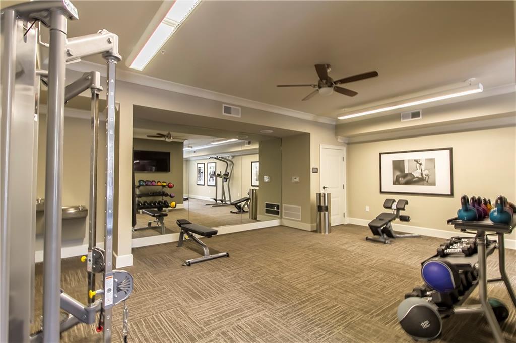 4011 Roswell Road, Unit 2311 Atlanta, GA 30342 - Photo 31 of 39 a view of a livingroom with couch and a workspace