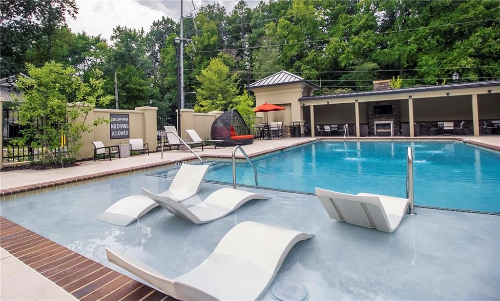 4011 Roswell Road, Unit 2311 Atlanta, GA 30342 - Photo 33 of 39 a view of a house with pool