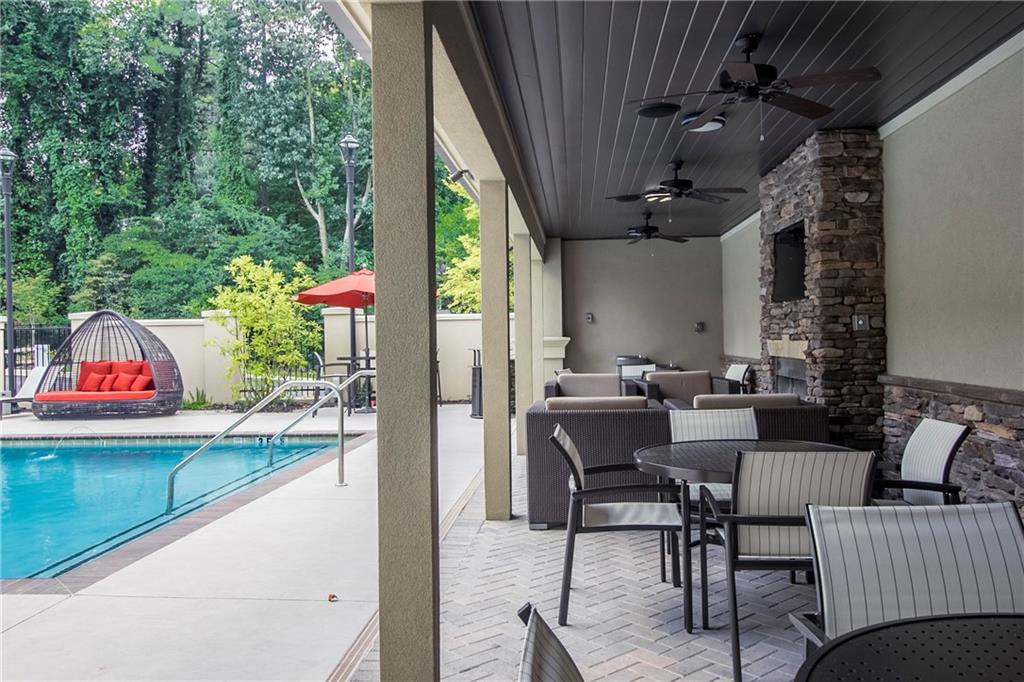 4011 Roswell Road, Unit 2311 Atlanta, GA 30342 - Photo 35 of 39 a patio with a table and chairs