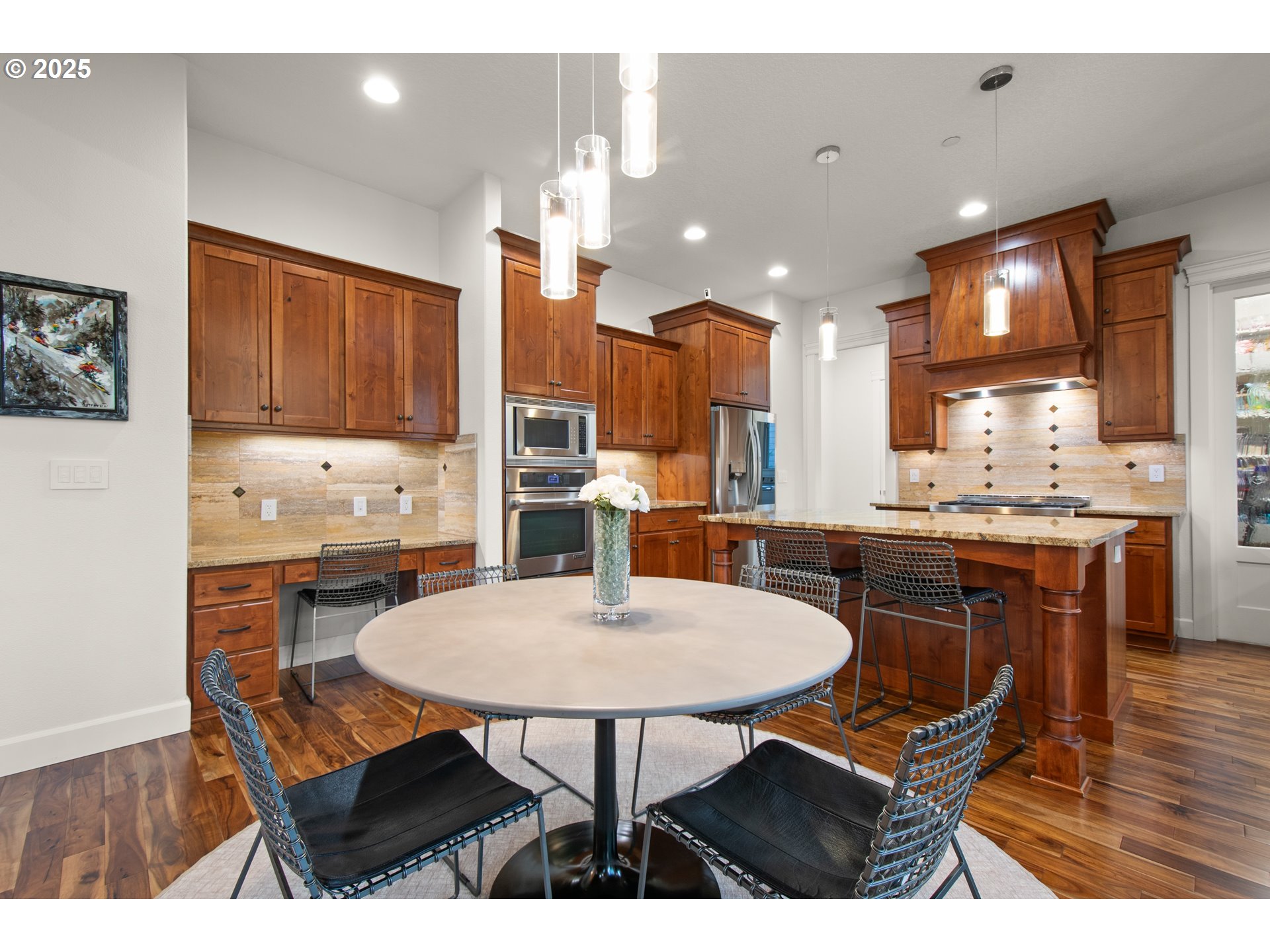 2215 Northwest 17th Avenue Camas, WA 98607 - Photo 15 of 48 a kitchen with stainless steel appliances kitchen island granite countertop a dining table chairs and a refrigerator
