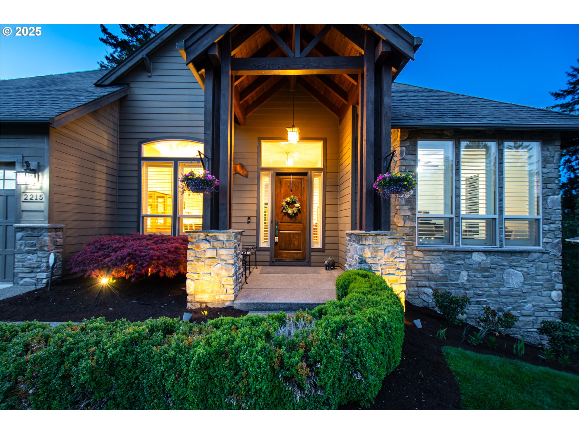2215 Northwest 17th Avenue Camas, WA 98607 - Photo 3 of 48 a view of a house with many windows and a big yard