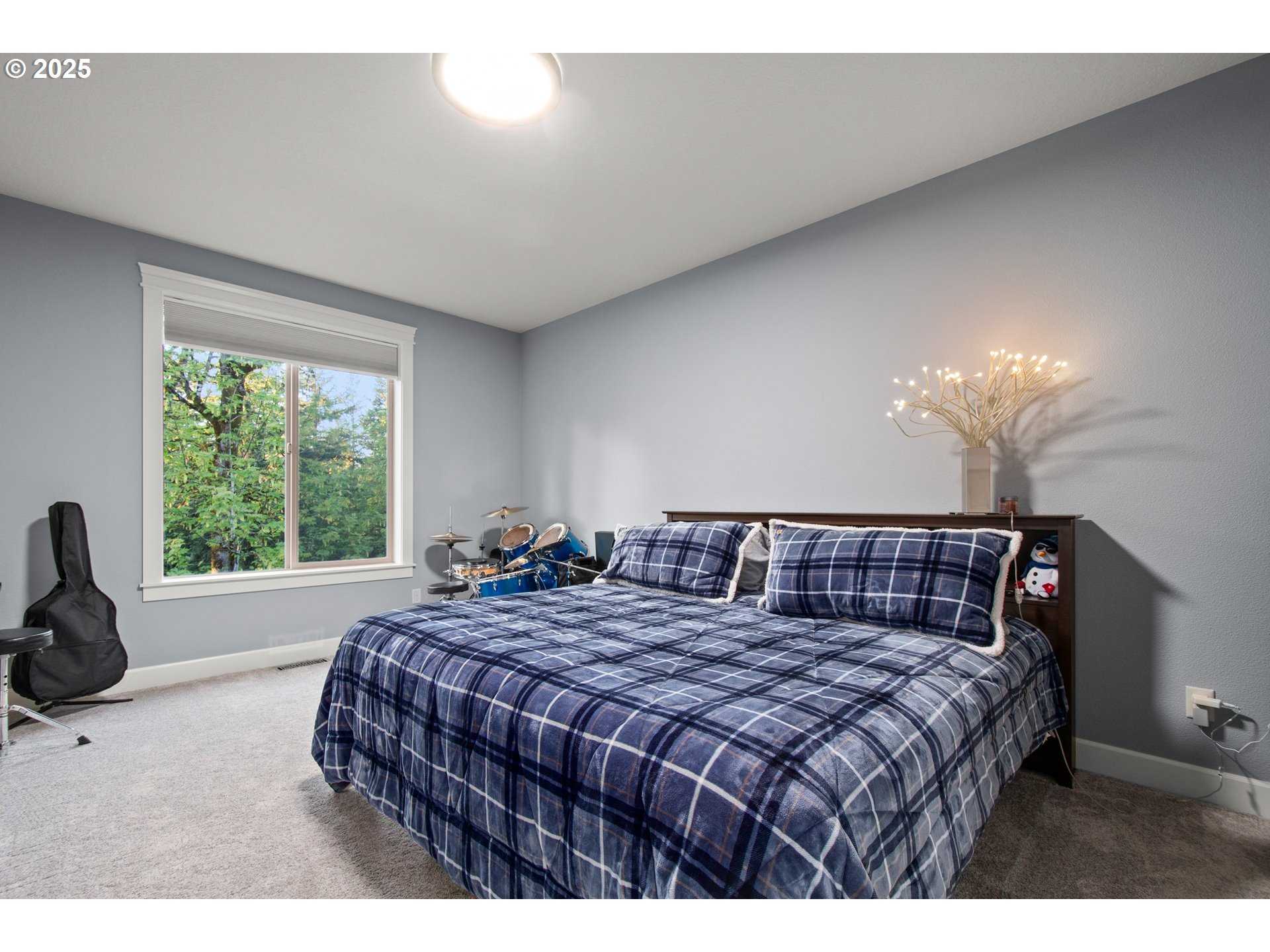2215 Northwest 17th Avenue Camas, WA 98607 - Photo 36 of 48 a bedroom with a large bed and a large window