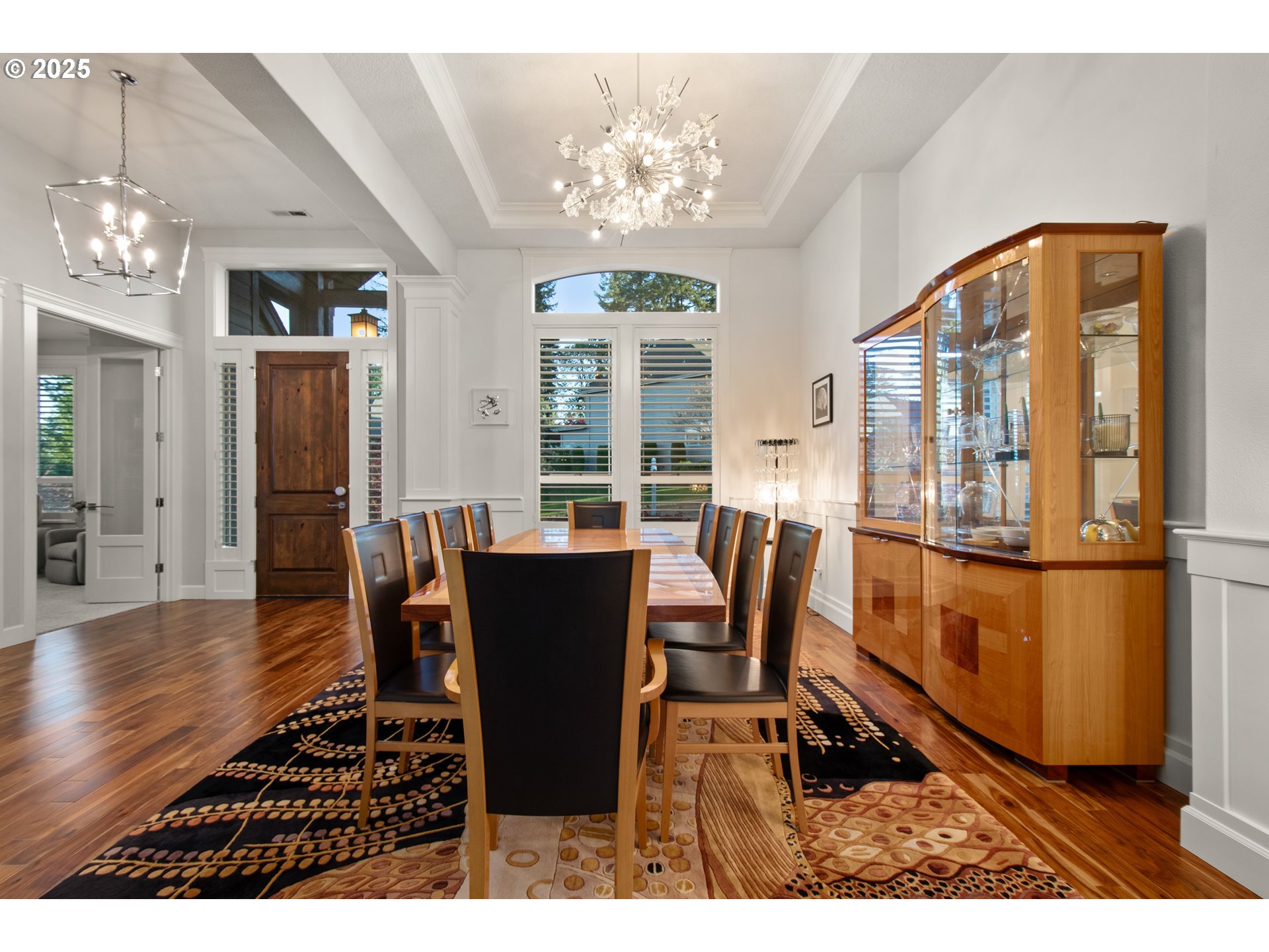 2215 Northwest 17th Avenue Camas, WA 98607 - Photo 9 of 48 a dining room with furniture a chandelier and wooden floor