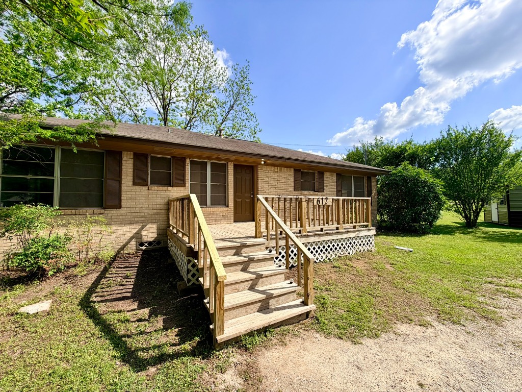 612 Keith Street Kennard, TX 75847 - Photo 1 of 15 a front view of a house with a yard