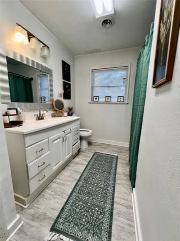a bathroom with a double vanity sink and mirror