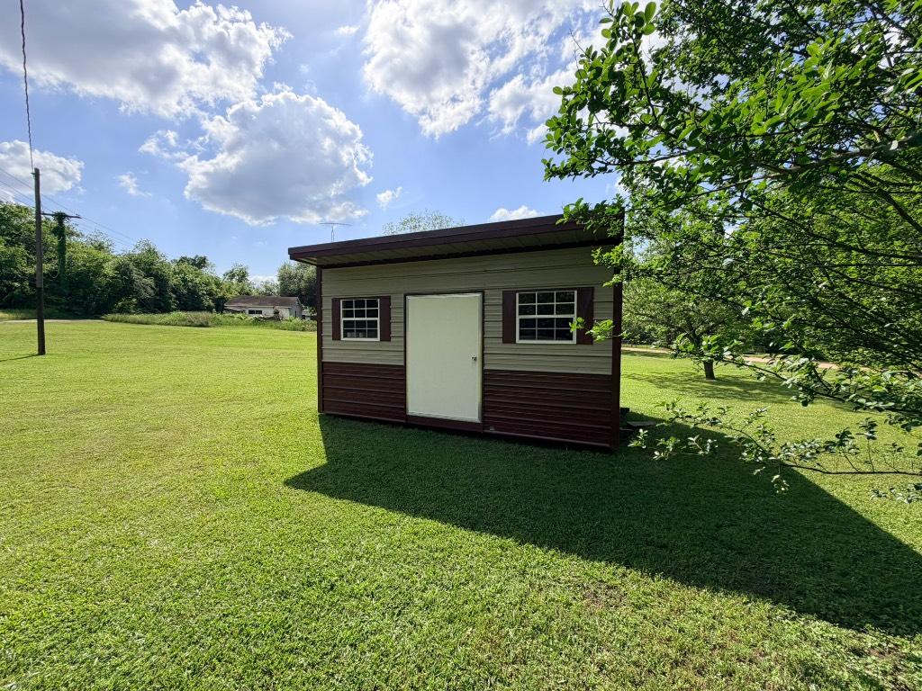 612 Keith Street Kennard, TX 75847 - Photo 6 of 15 a view of a backyard with large trees