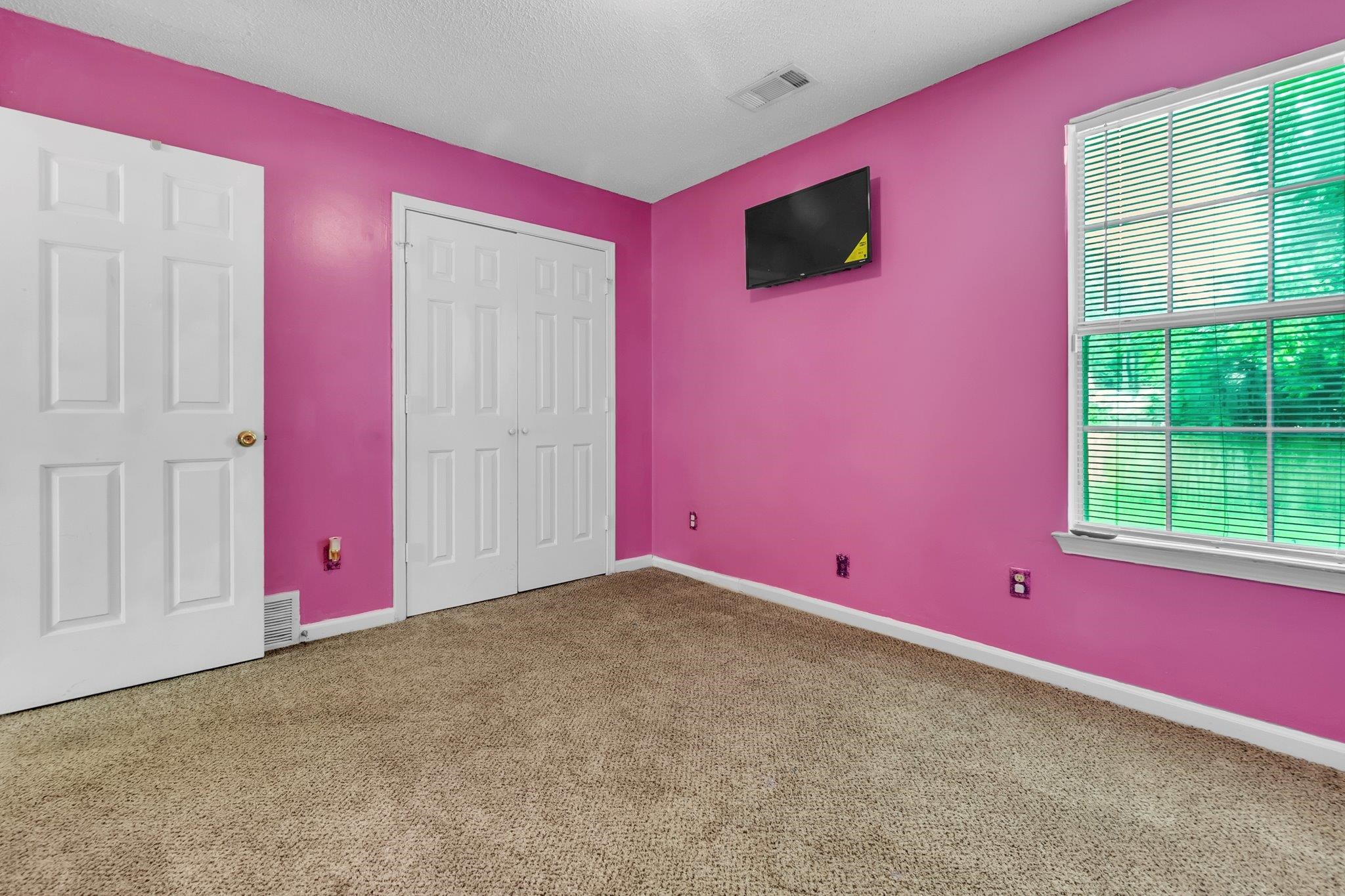 5930 Chadwell Road Millington, TN 38053 - Photo 7 of 17 Spacious room featuring carpet flooring, crisp white trim, and a window with blinds