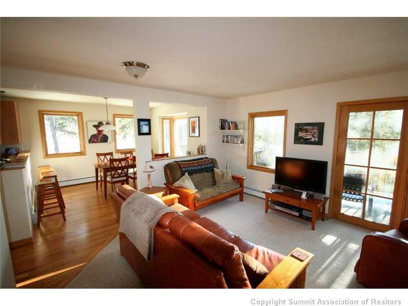 79 Bearing Tree Road Breckenridge, CO 80424 - Photo 2 of 25 a living room with furniture and a flat screen tv