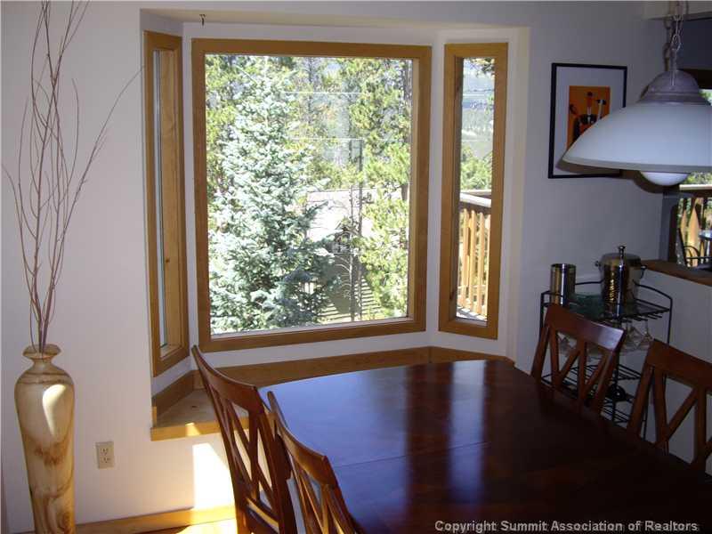 79 Bearing Tree Road Breckenridge, CO 80424 - Photo 14 of 25 a view of a dining room with furniture window and wooden floor