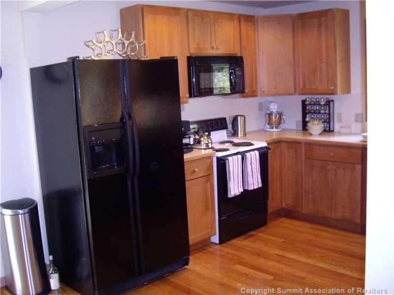 79 Bearing Tree Road Breckenridge, CO 80424 - Photo 17 of 25 a kitchen with stainless steel appliances granite countertop a refrigerator stove and sink