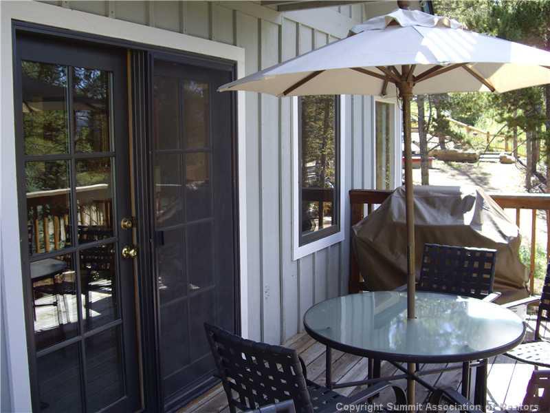 79 Bearing Tree Road Breckenridge, CO 80424 - Photo 19 of 25 a backyard of a house with table and chairs