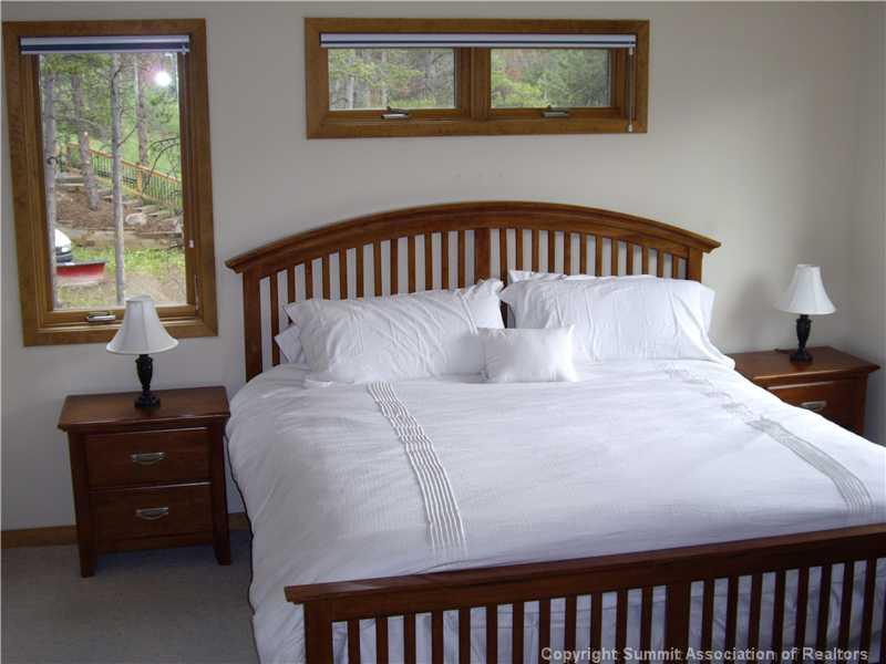79 Bearing Tree Road Breckenridge, CO 80424 - Photo 21 of 25 a bedroom with a bed and window
