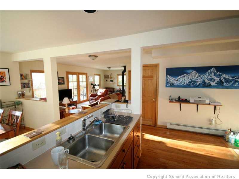 79 Bearing Tree Road Breckenridge, CO 80424 - Photo 5 of 25 a kitchen with a sink and a wooden floor